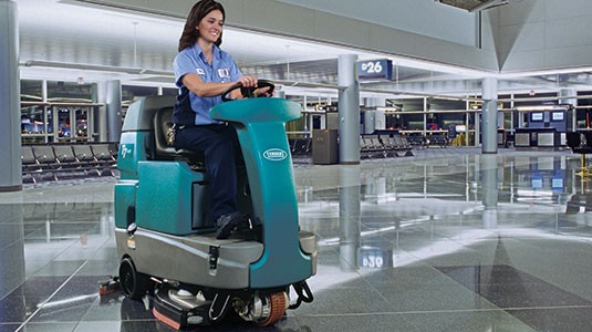 Tennant T7 Ride-On Scrubber cleaning an airport
