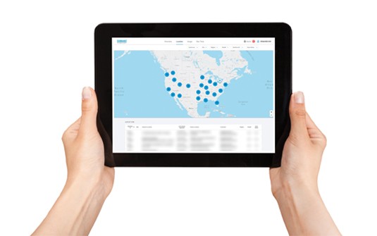 Tennant's IRIS Asset Manager portal on mobile tablet to manage your floor cleaner fleet
