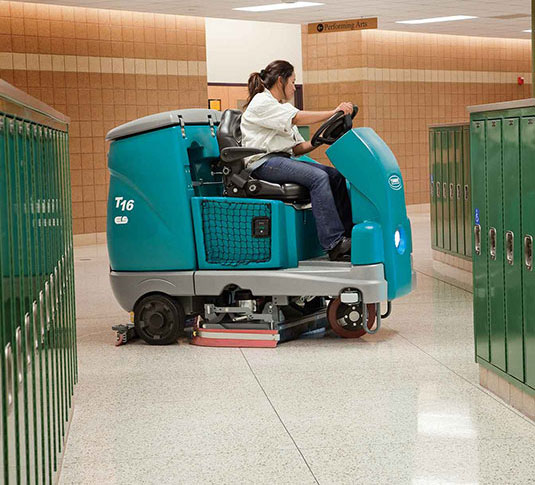 Tennant T16 Ride-On Scrubber cleaning in a school